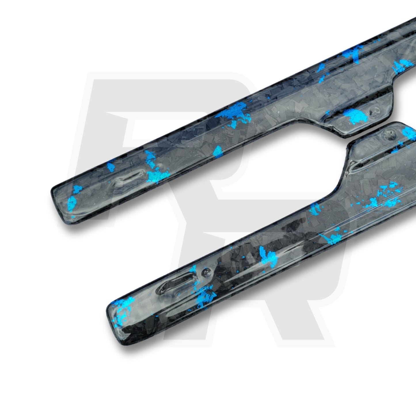 Two carbon fiber components with blue fiber reinforcement on a white background from road rush